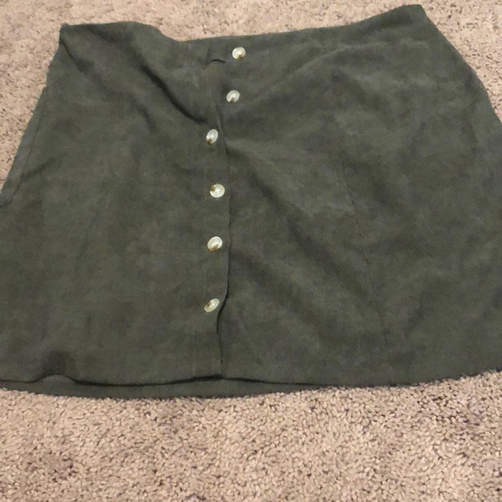 This is a green button up skirt from SHEIN and in a XL or 14